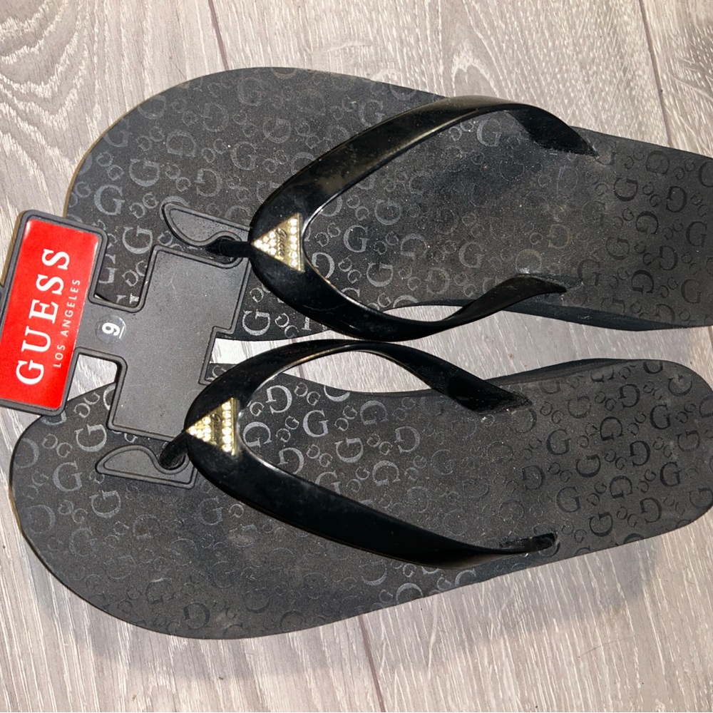 Guess Black Flip Flops with Gold Accents